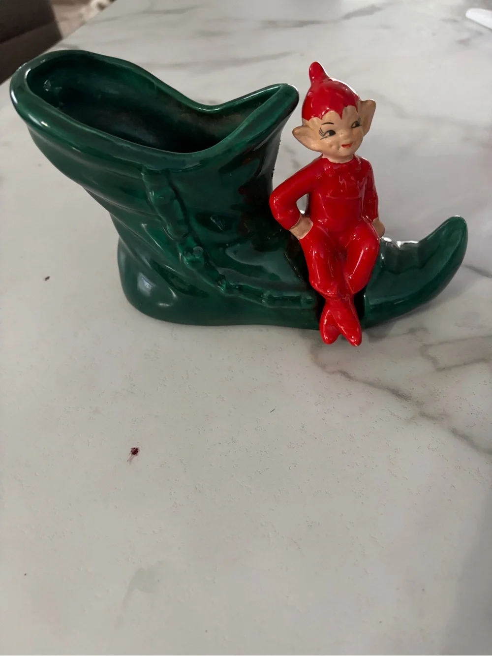 Vintage mid century ceramic pixie elf on a green boot 1950s